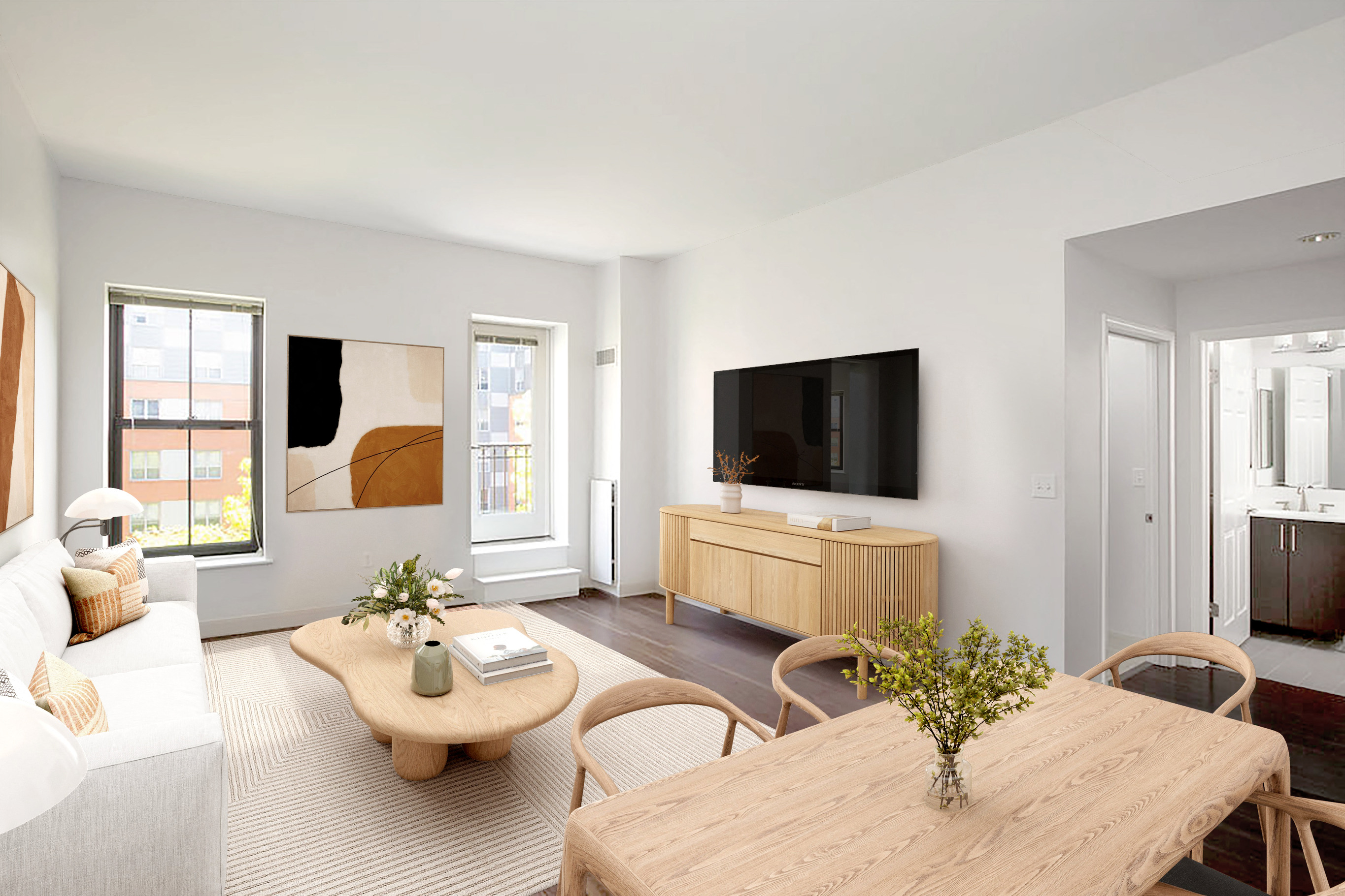 a living room with a couch and a table and a tv